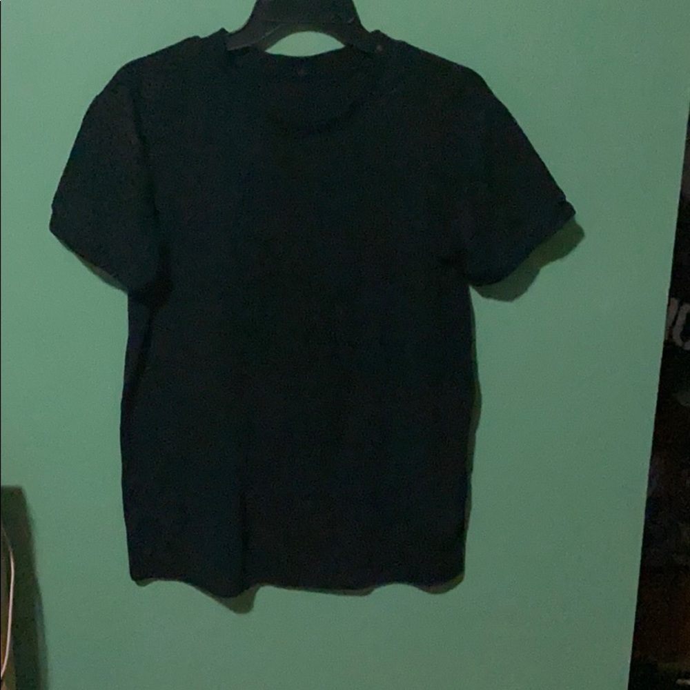 Black shirt and white letters.